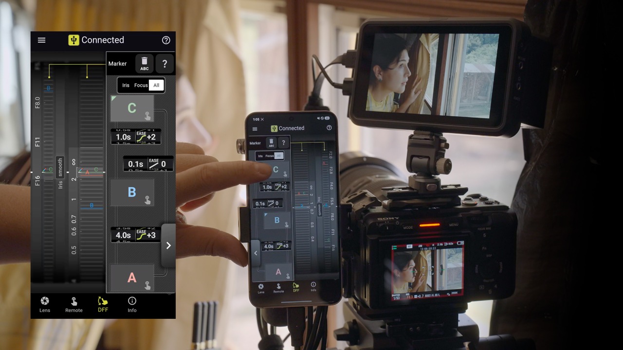 TAMRON Lens Utility auf dem Smartphone zur Steuerung von Fokus- und Irismarkern an einer Kamera im Innenraum