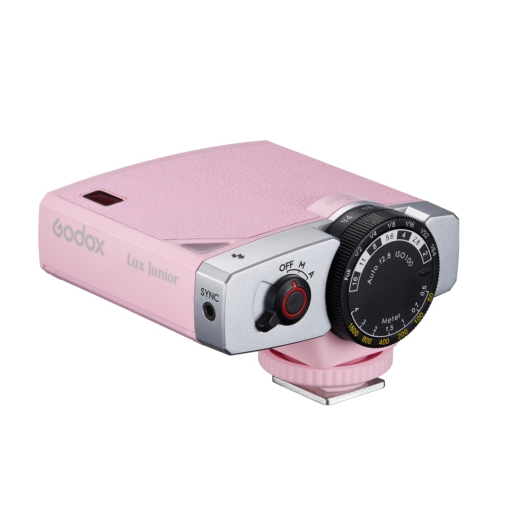 Godox Lux Junior Blitzgerät in Pink – schräge Seitenansicht mit Leistungsregler, Synchronanschluss und Blitzschuh