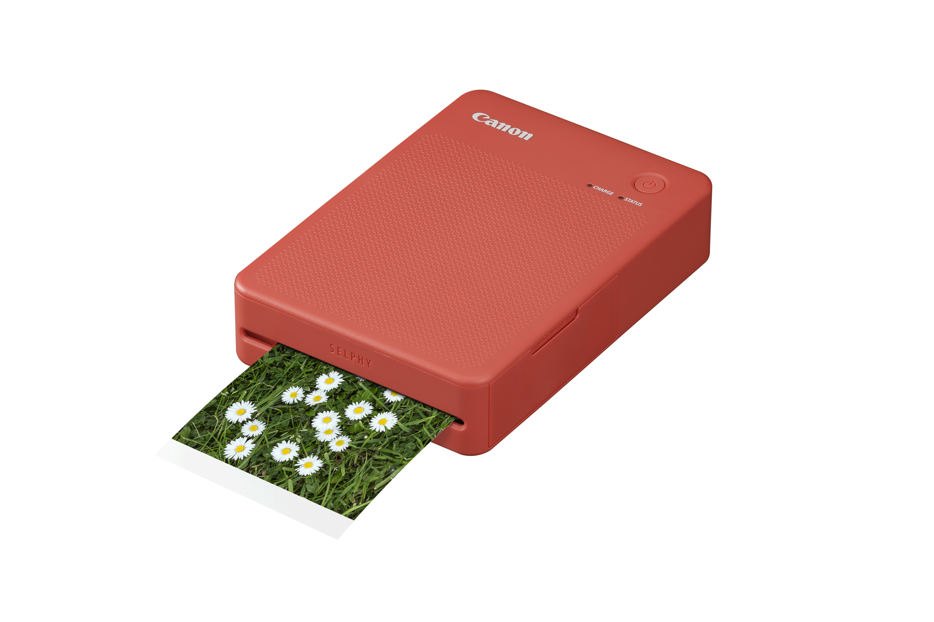 SELPHY QX20 Fotodrucker (terrakotta) Canon Selphy X20 Mobiler Fotodrucker in der Farbe Terrakotta, Schräg liegend mit halbausgedrucktem Foto