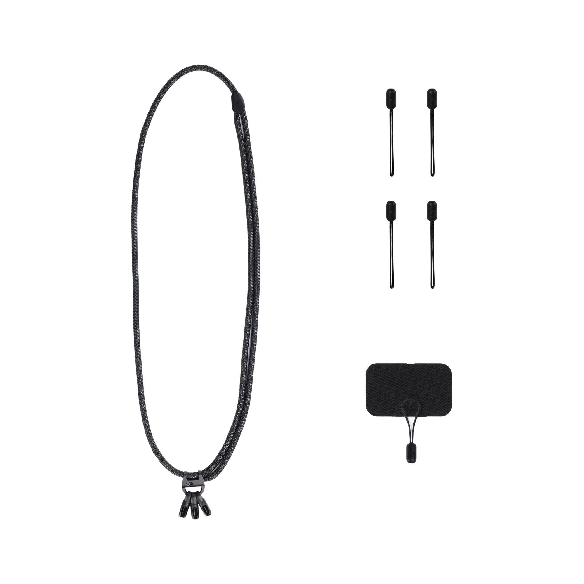 Lieferumfang des Peak Design Mobile Crossbody Multi-Strap in Schwarz mit Ankerschlaufen und Montagepad.