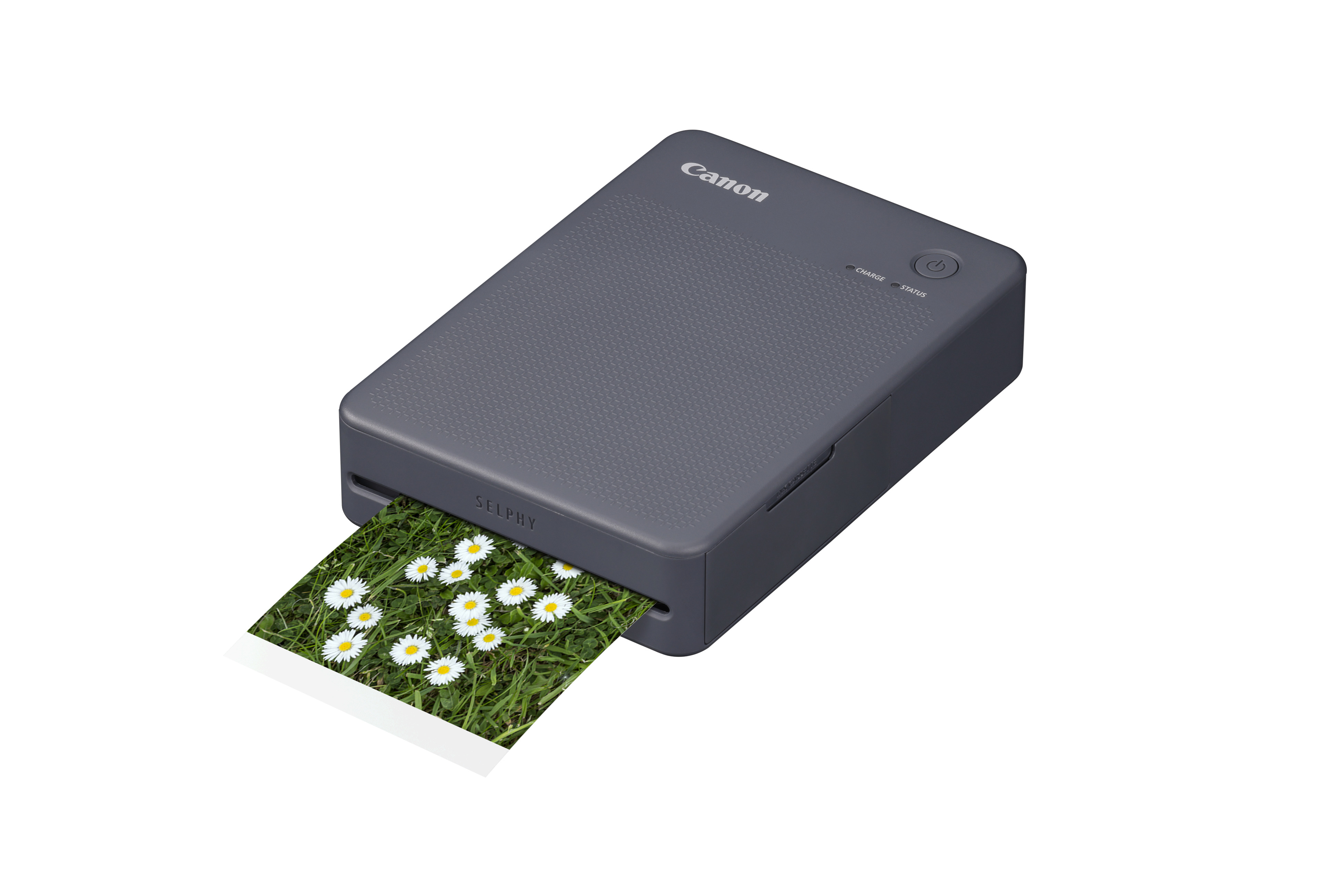 SELPHY QX20 Fotodrucker (dunkelgrau) Canon Selphy X20 Mobiler Fotodrucker in der Farbe Dunkelgrau, Schräg liegend mit halbausgedrucktem Foto