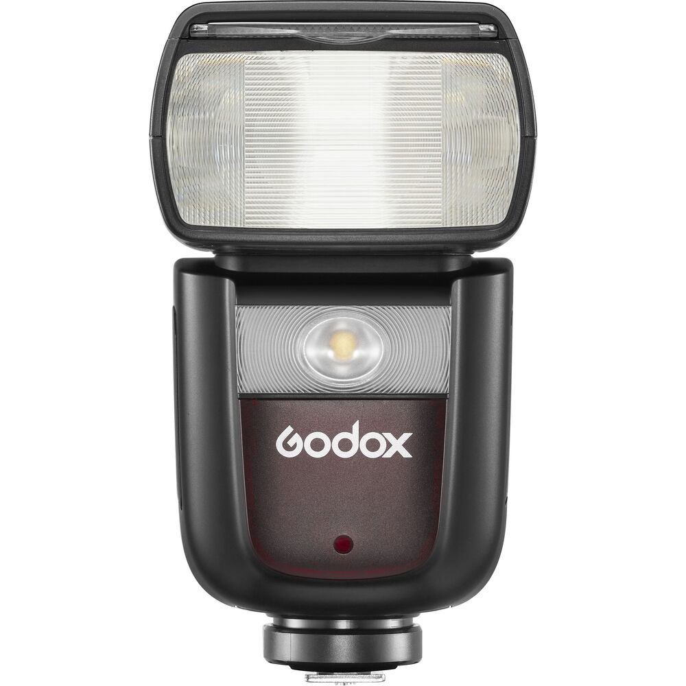 Godox V860III Speedlite für OM SYSTEM und Panasonic in Vorderansicht mit Blitzreflektor und LED-Einstelllicht.